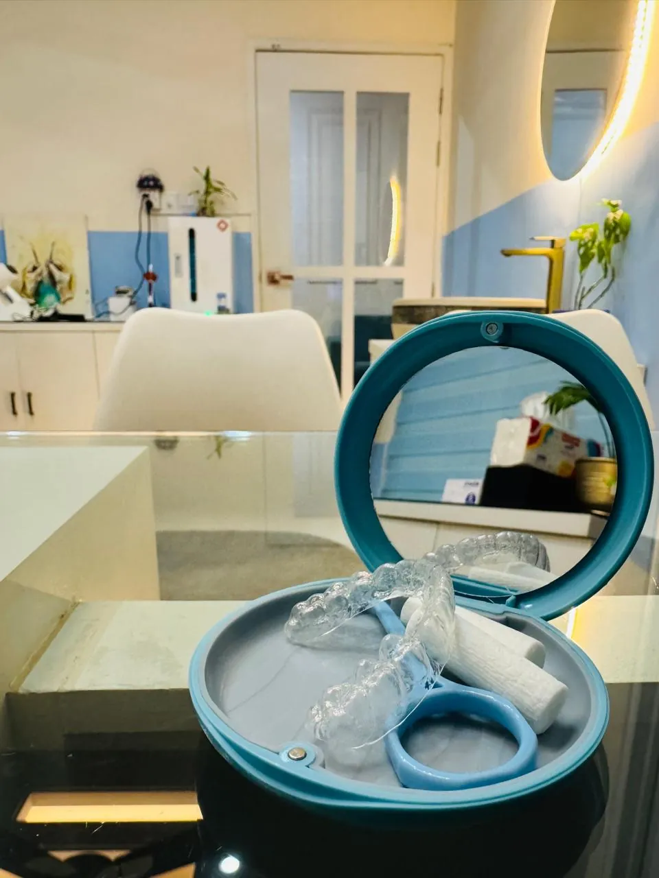 A patient wearing a clear aligner during treatment