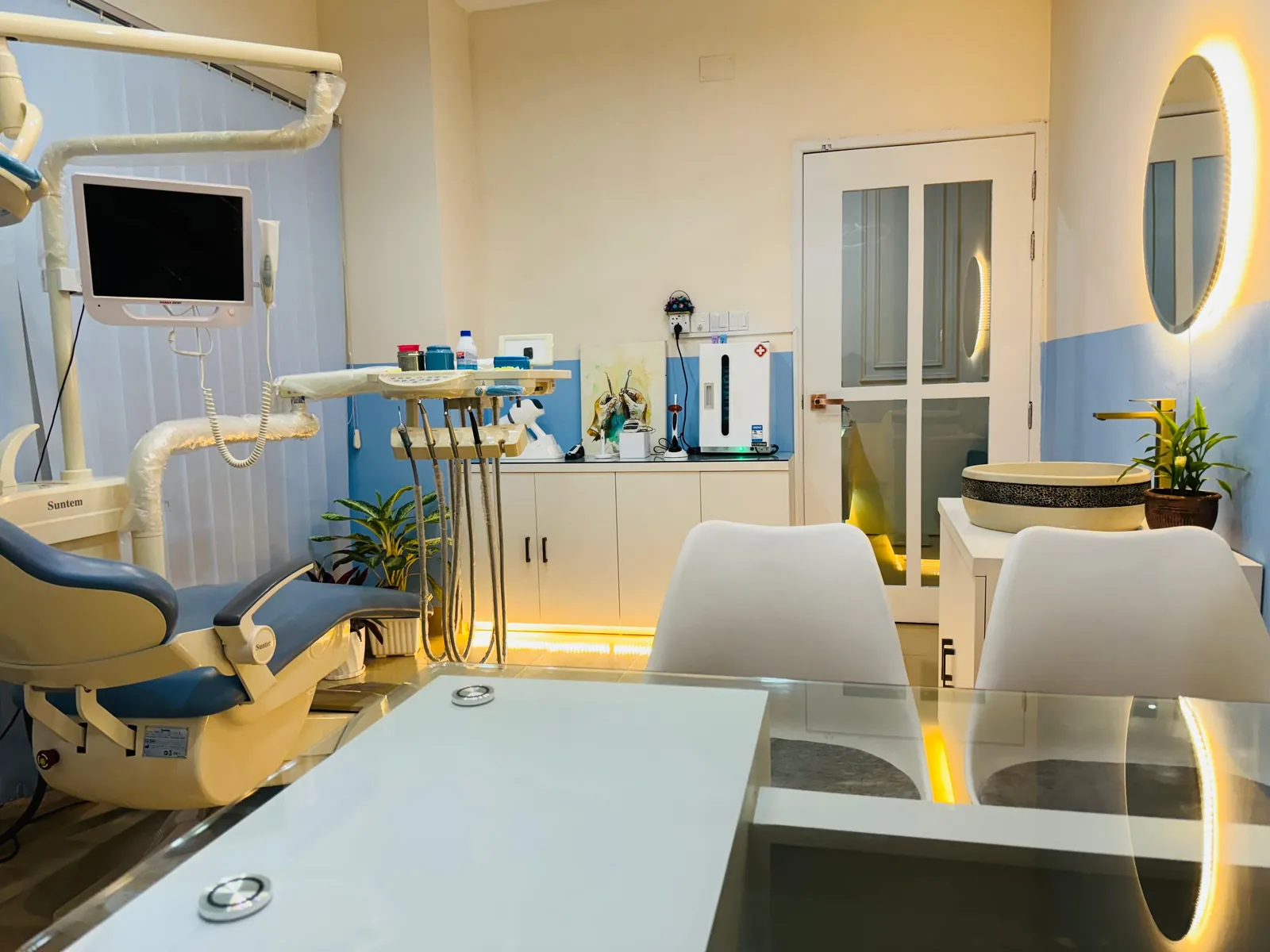 Dentists reviewing an x-ray with a patient before treatment